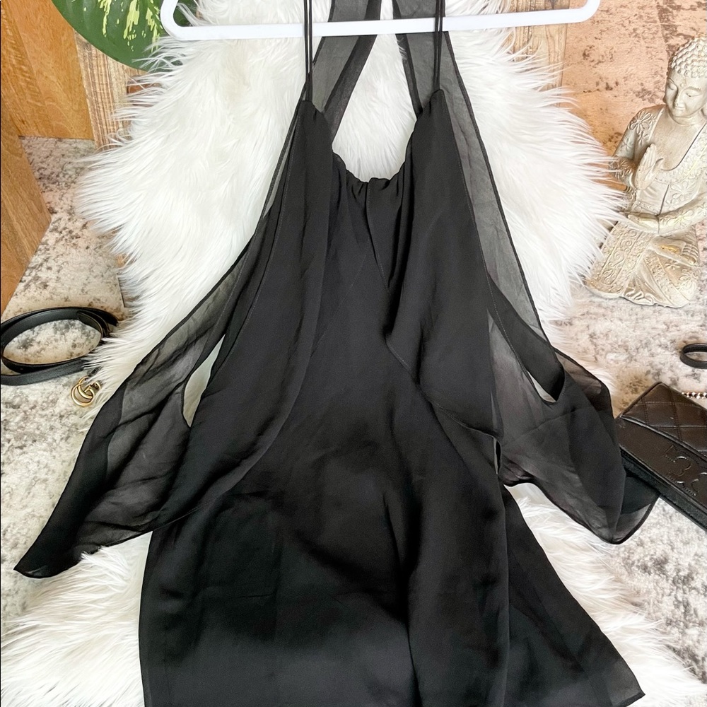 Black, flowing blouse.
